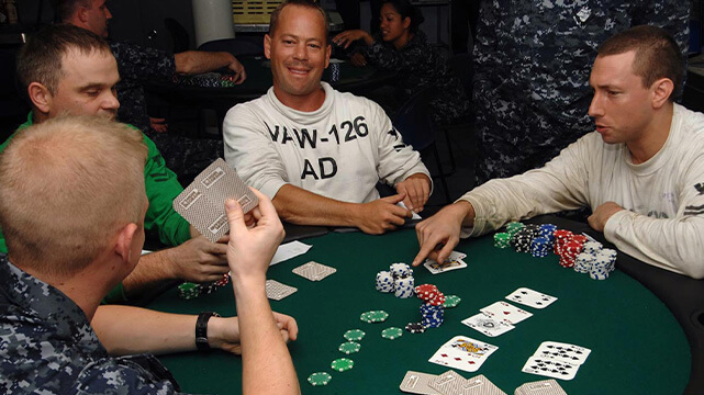 Men Sitting Around Poker Table