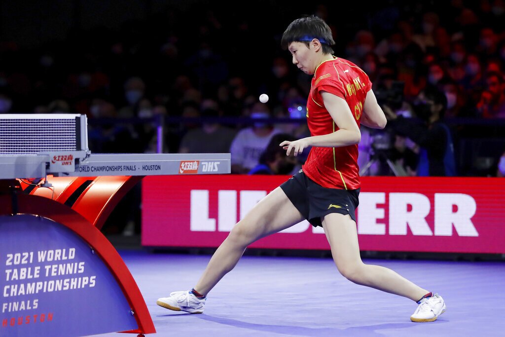 China's Manyu Wang returns a volley during the women's singles finals match during the World Table Tennis Championships Monday, Nov. 29, 2021, in Houston. (AP Photo/Michael Wyke)