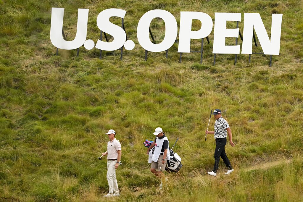 Berry Henson and Ryutaro Nagano walk on the eighth hole during the first round of the U.S. Open golf tournament at Los Angeles Country Club on Thursday, June 15, 2023, in Los Angeles. (AP Photo/Lindsey Wasson)