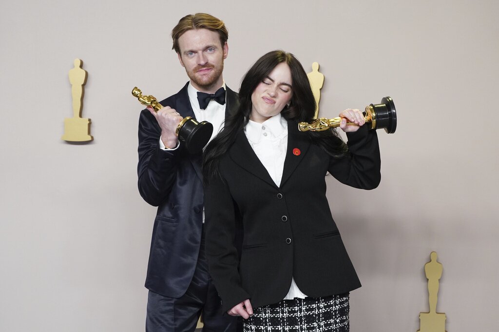 Finneas O'Connell, left, and Billie Eilish pose in the press room with the award for best original song for "What Was I Made For?" from "Barbie" at the Oscars on Sunday, March 10, 2024, at the Dolby Theatre in Los Angeles. (Photo by Jordan Strauss/Invision/AP)