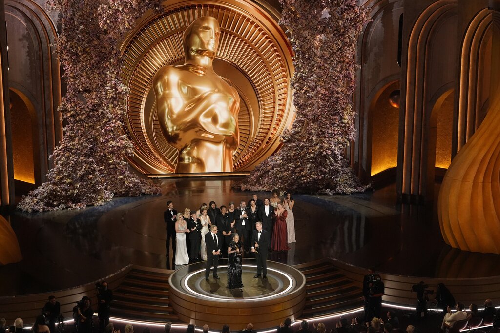 The cast and crew of "Oppenheimer" accept the award for best picture during the Oscars on Sunday, March 10, 2024, at the Dolby Theatre in Los Angeles. (AP Photo/Chris Pizzello)