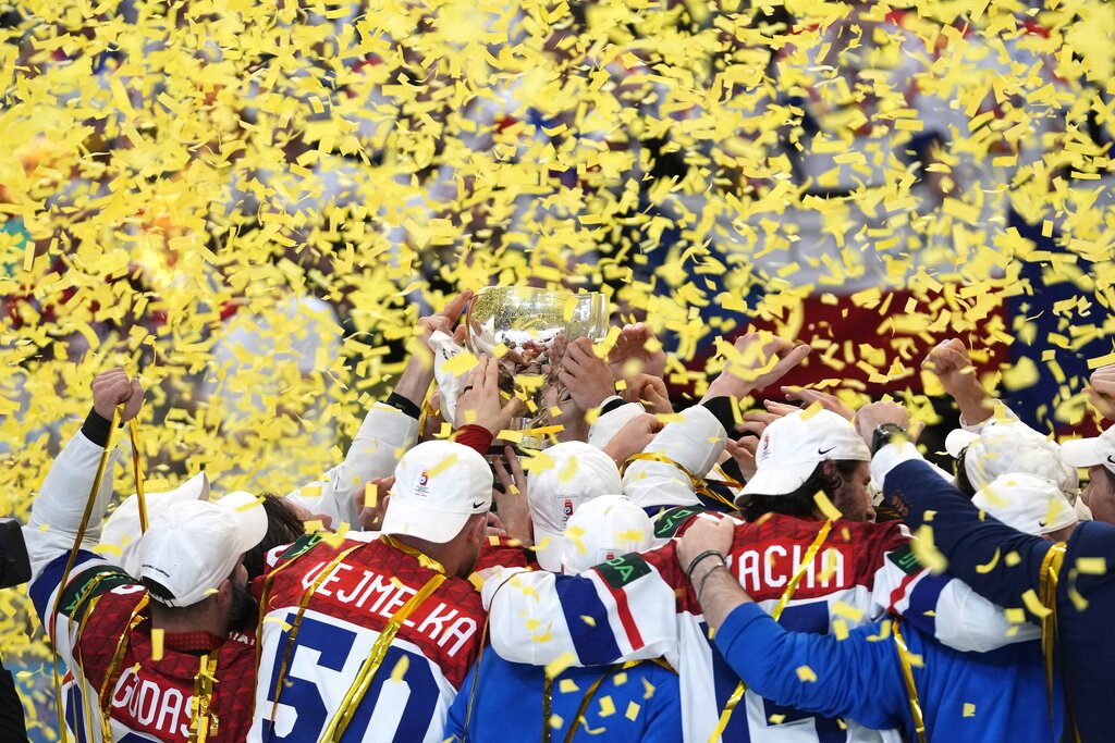 Members of the Czech Republic team celebrate with their trophy after they defeated Switzerland 2-0 in a gold medal match between Czech Republic and Switzerland at the Ice Hockey World Championships in Prague, Czech Republic, Sunday, May 26, 2024. (AP Photo/Petr David Josek)