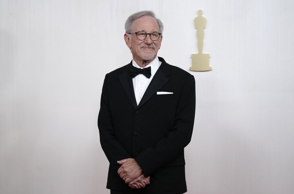 FILE - Steven Spielberg arrives at the Oscars, March 10, 2024, in Los Angeles. Celebrities including Spielberg are increasingly lending their star power to President Joe Biden, hoping to energize fans to vote for him in November or entice donors to open their checkbooks for his reelection campaign. (AP Photo/Ashley Landis, File)