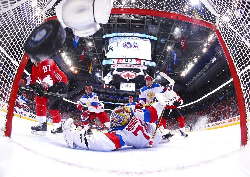 Team Canada's Sidney Crosby (87) scores on Team Russia's goalie Sergei Bobrovsky (72) during the first period of a World Cup of Hockey semifinal game, Saturday, Sept. 24, 2016 in Toronto. (AP Photo/Bruce Bennett, Pool)