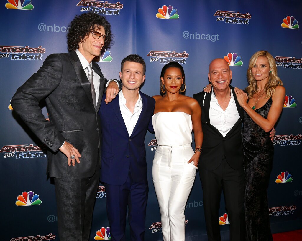 From left, Howard Stern, winner Mat Franco, Melanie Brown, Howie Mandel and Heidi Klum walk the "America's Got Talent" finale post-show red carpet on Wednesday, Sept. 17, 2014 in New York. (Photo by Greg Allen/Invision/AP)