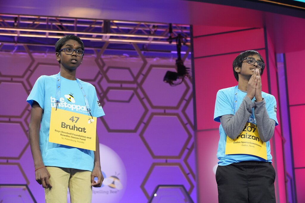 Bruhat Soma, 12, of Tampa, Fla., left, reacts in shock after winning the Scripps National Spelling Bee, in Oxon Hill, Md., Thursday, May 30, 2024, as Faizan Zaki, 12, of Allen, Texas, stands next to him. (AP Photo/Jacquelyn Martin)